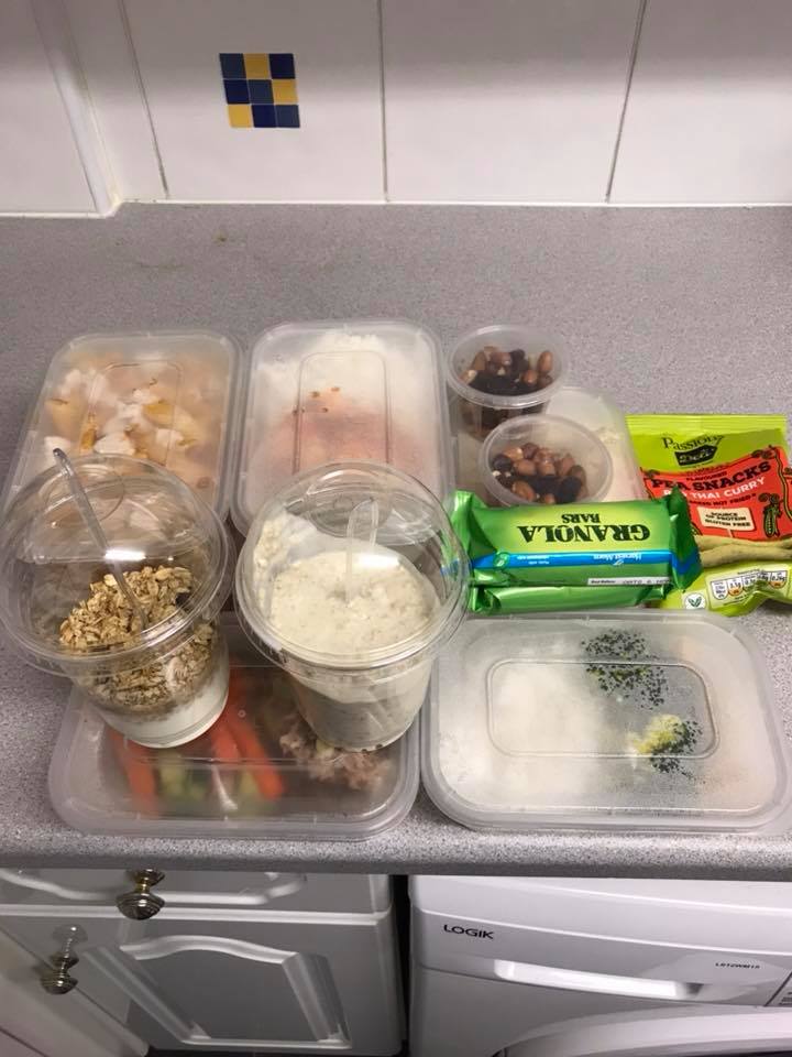 Healthy food in containers on counter top.